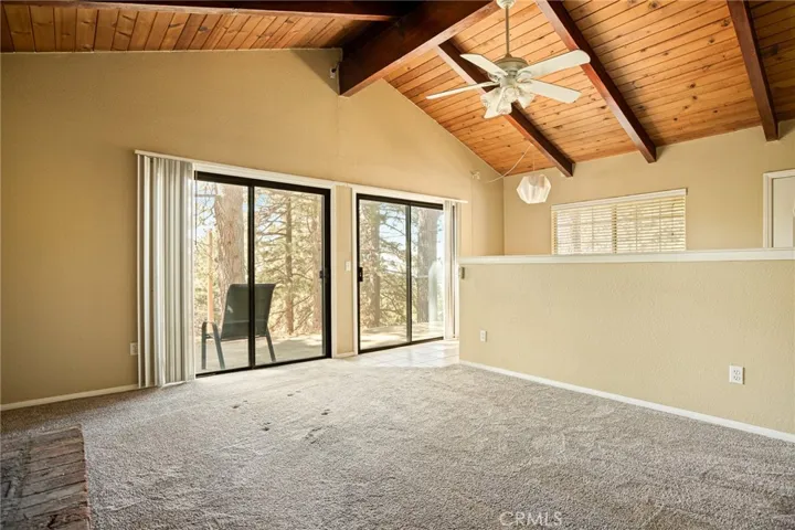 Living room with access to side patio.