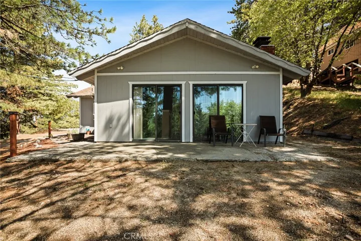 Living room slider doors and patio.