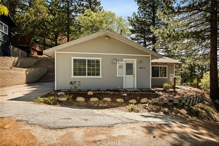 Front of home - left has driveway parking area for 2.