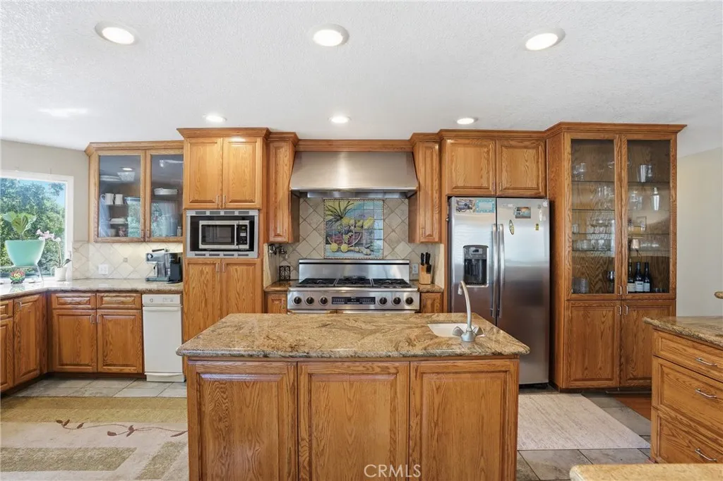 Larger chefs kitchen with sink in island for prep use or daily.
