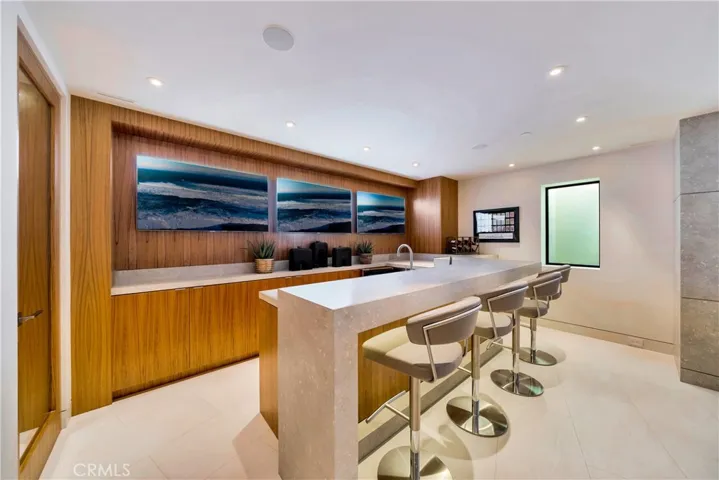 second bar with 3 tv's behind