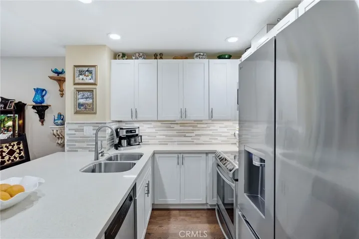Remodeled kitchen with quartz countertops, new cabinetry and SS appliances.