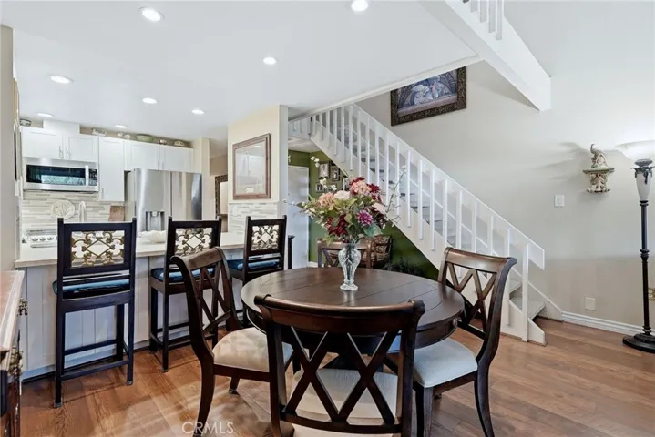 Another view of dining area and kitchen.