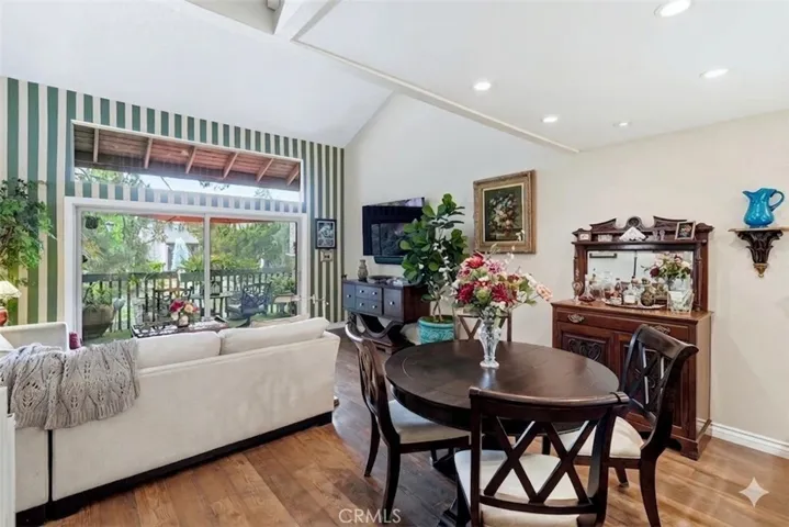 Living room and dining area with view in background.