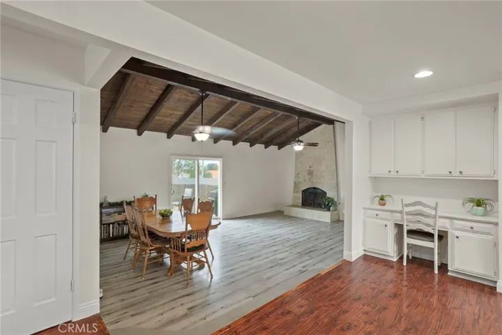 Vaulted ceilings and a stone fireplace create a warm, inviting atmosphere