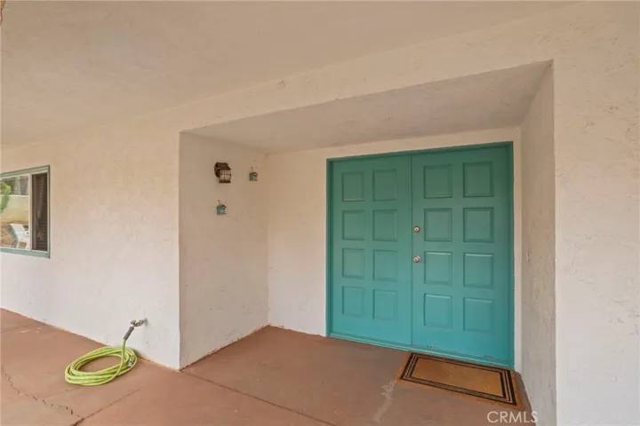 Inviting covered entry sets the tone for this charming home