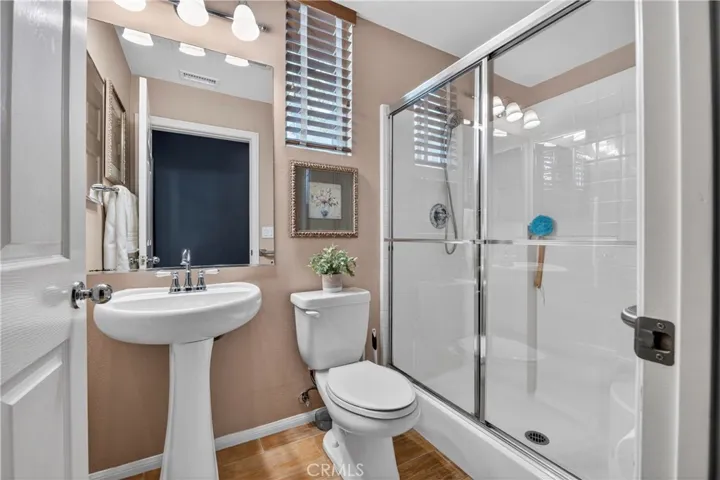 Downstairs Bathroom complete with a shower
