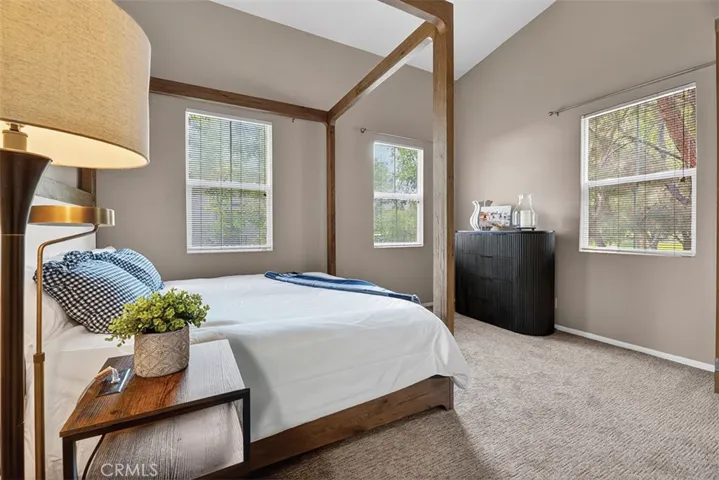 Spacious Primary Suite with vaulted ceilings.