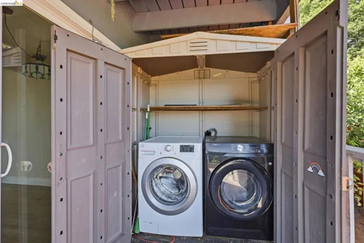 Outdoor laundry station within a dedicated utility enclosure