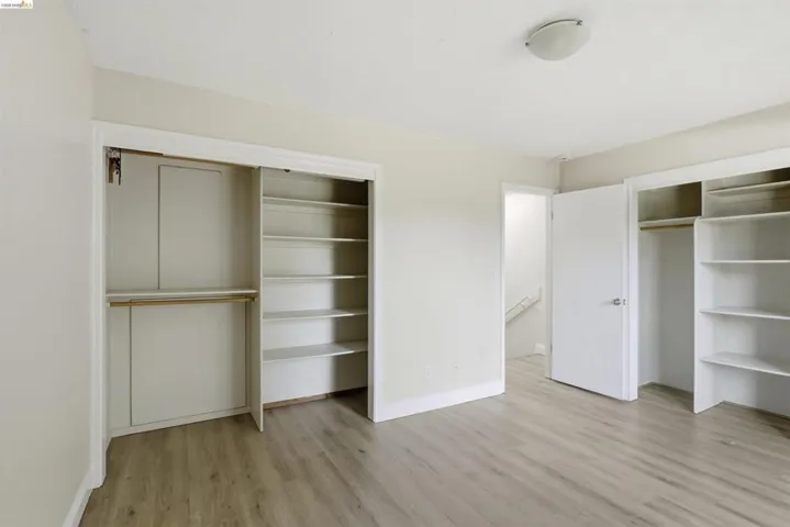 Light-toned wood-finish flooring complements neutral wall tones