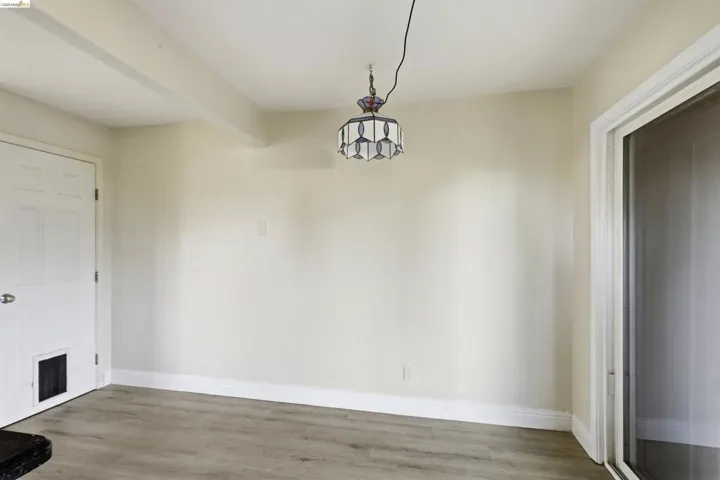 Light-toned walls complement wood-finish flooring