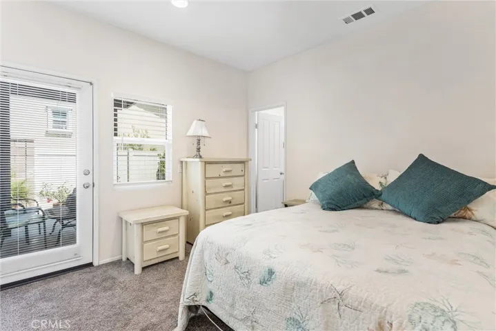 Adu Bedroom, with door leading to it's own patio