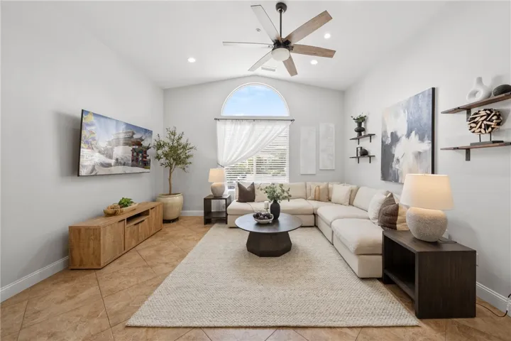 Spacious living room designed to accommodate a full size sectional sofa.