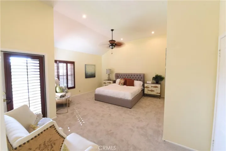 large master bedroom with cathedral ceilings