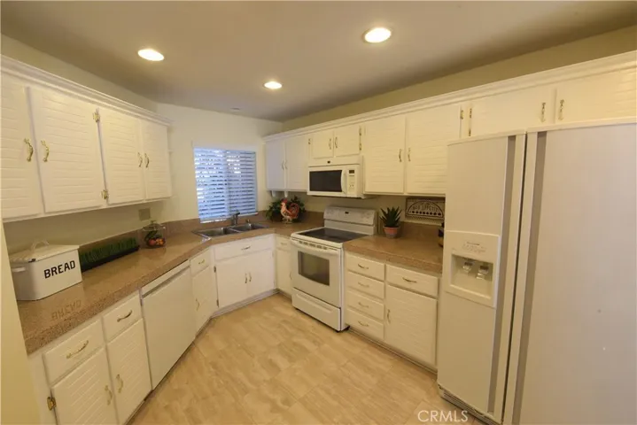 kitchen with granite countertop and stone tile floor