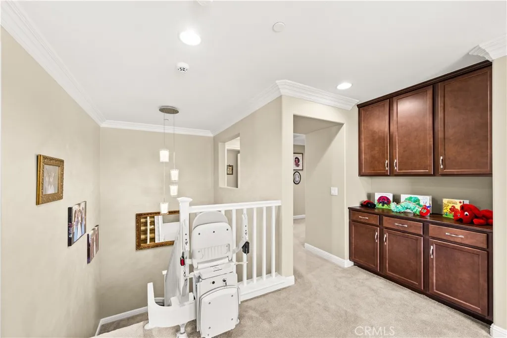 Upstairs features a oversized loft with 4 additional bedrooms and 2 full bathrooms