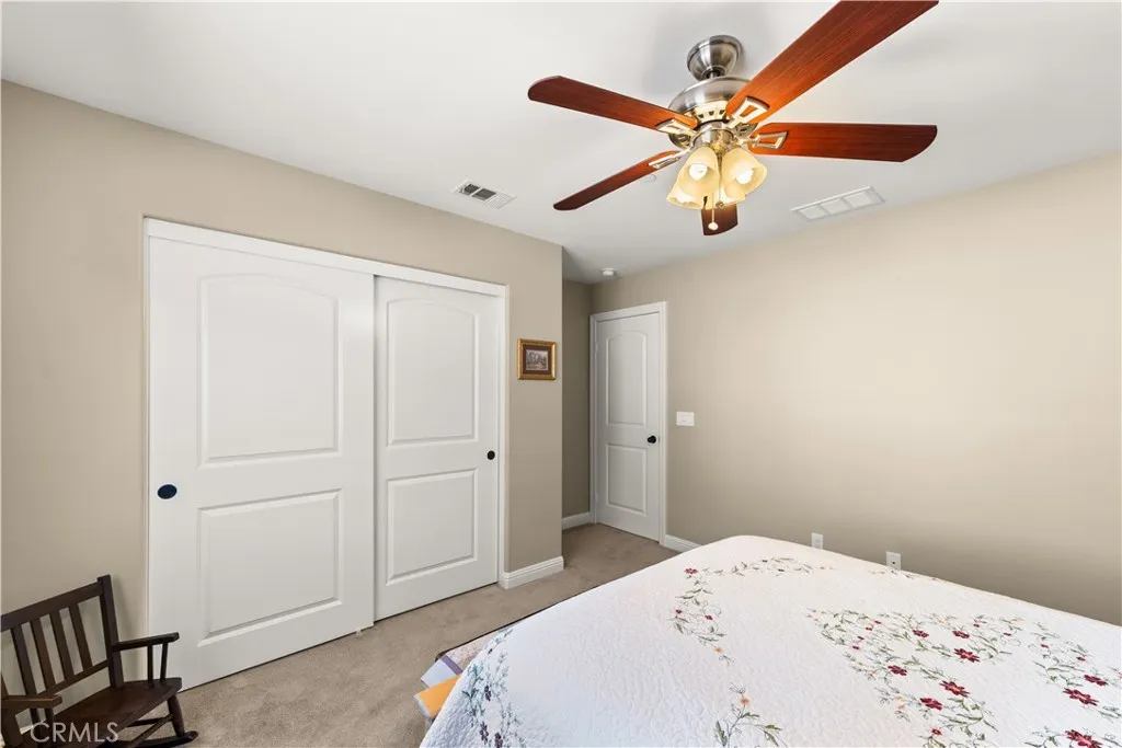 Upstairs bed 3 with lighted ceiling fan