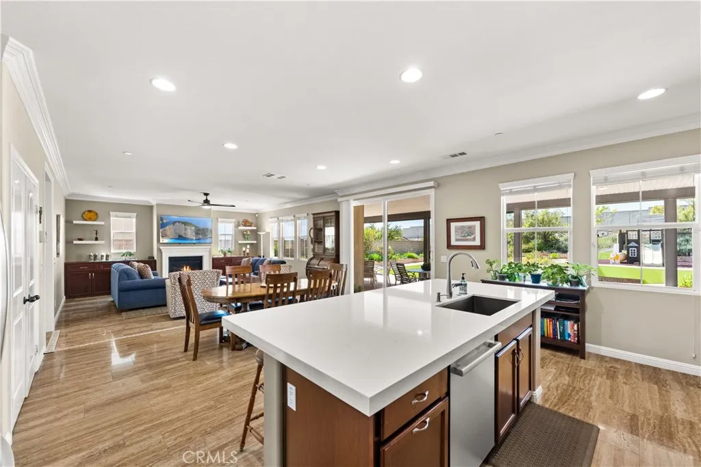 Remodeled kitchen with recessed lighting, custom cabinets, pull out drawrs, and Quartz counter tops with Tile backsplash
