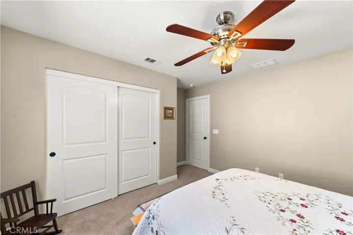 Upstairs bed 3 with lighted ceiling fan