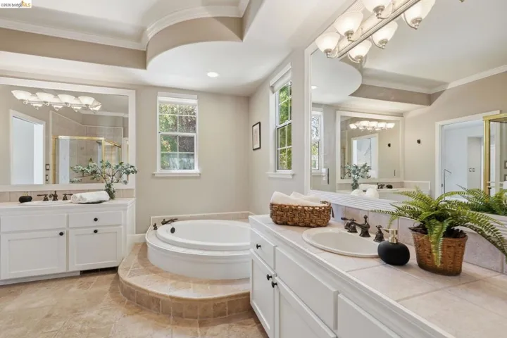 Recessed soaking tub with surrounding tiled steps
