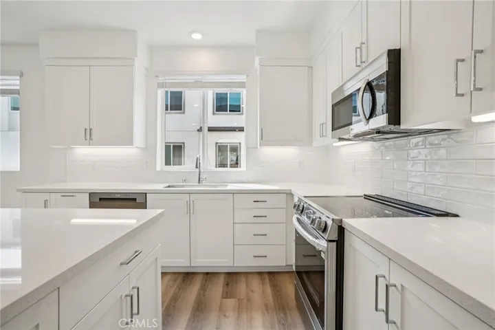 Kitchen with large island and all-electric appliances