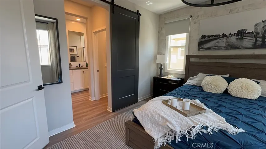 Primary bedroom with en suite and barn door