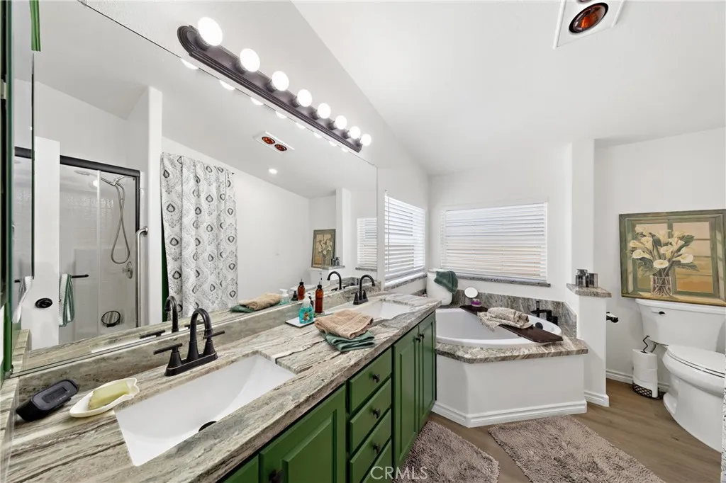 There is a Glass Enclosed Shower Behind Door

