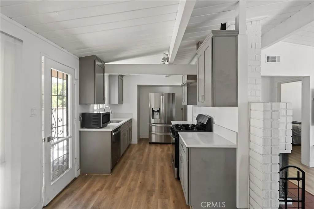 Remodeled kitchen with stainless steel appliances.
