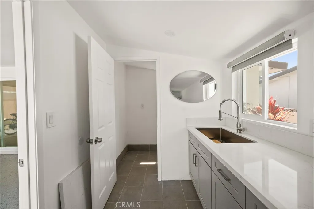 The room of the garage has a quarter bathroom