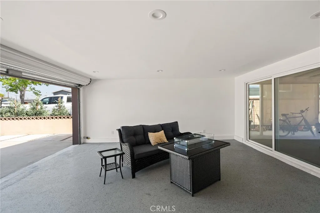 The finished garage boasts recessed lighting, epoxy flooring and is fully insulated | Original Photo