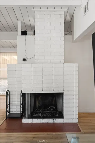 The living room enjoys this standalone fireplace.