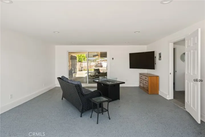 The finished garage has an insulated garage door that rolls up compactly without the obtrusive garage door track | Original photo