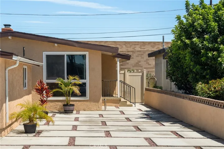 The front of the house has large pavers designed to support RV parking