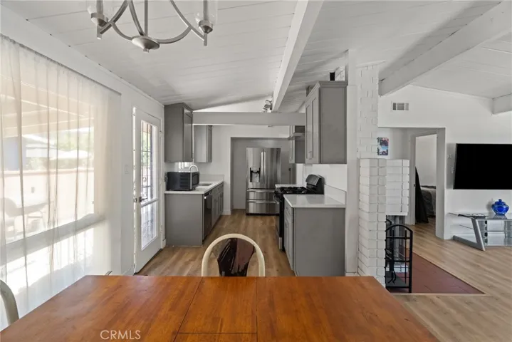The dining area opens to the remodeled kitchen