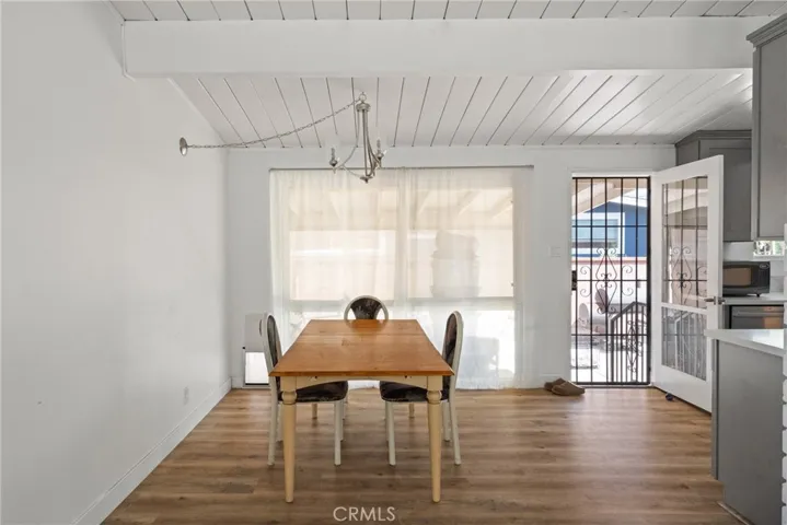 Dining area enjoys floor to ceiling windows. | Original Photo