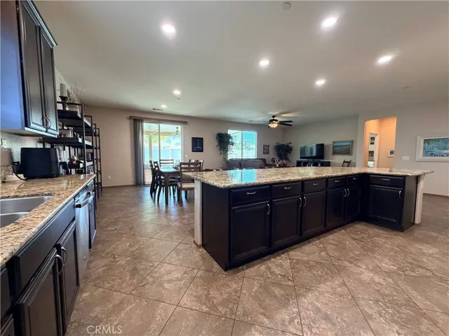 So much room for multiple people to navigate around each other in this oversized kitchen