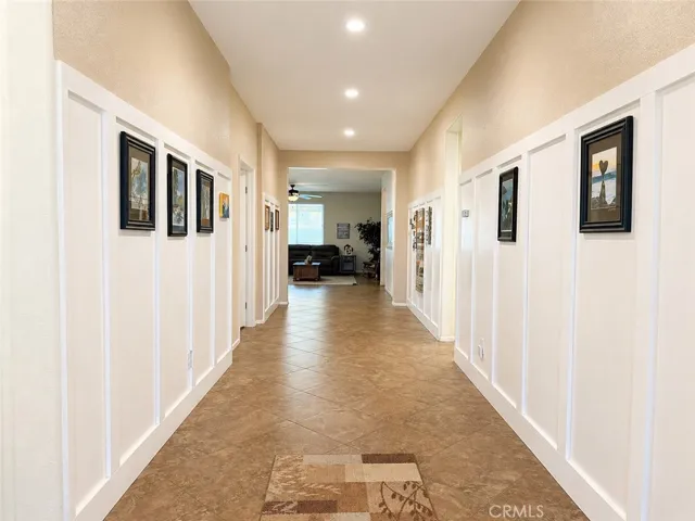 Hallway wainscotting trim from the front door to the Great Room makes a perfect gallery for your portraits and art
