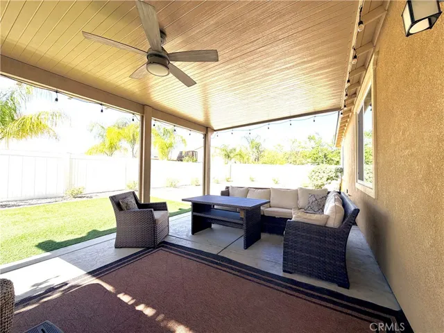 View from sliding patio door to your shady retreat. Overhead fan to give you a refreshing breeze no matter the weather