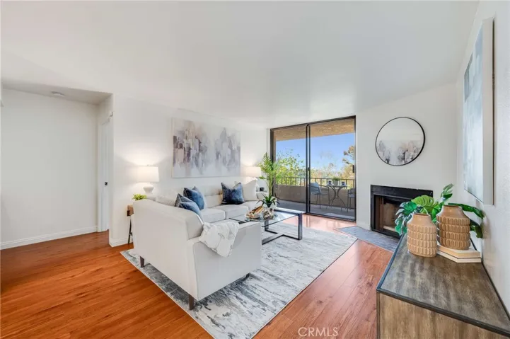 Living Room with balcony, fireplace, and View!