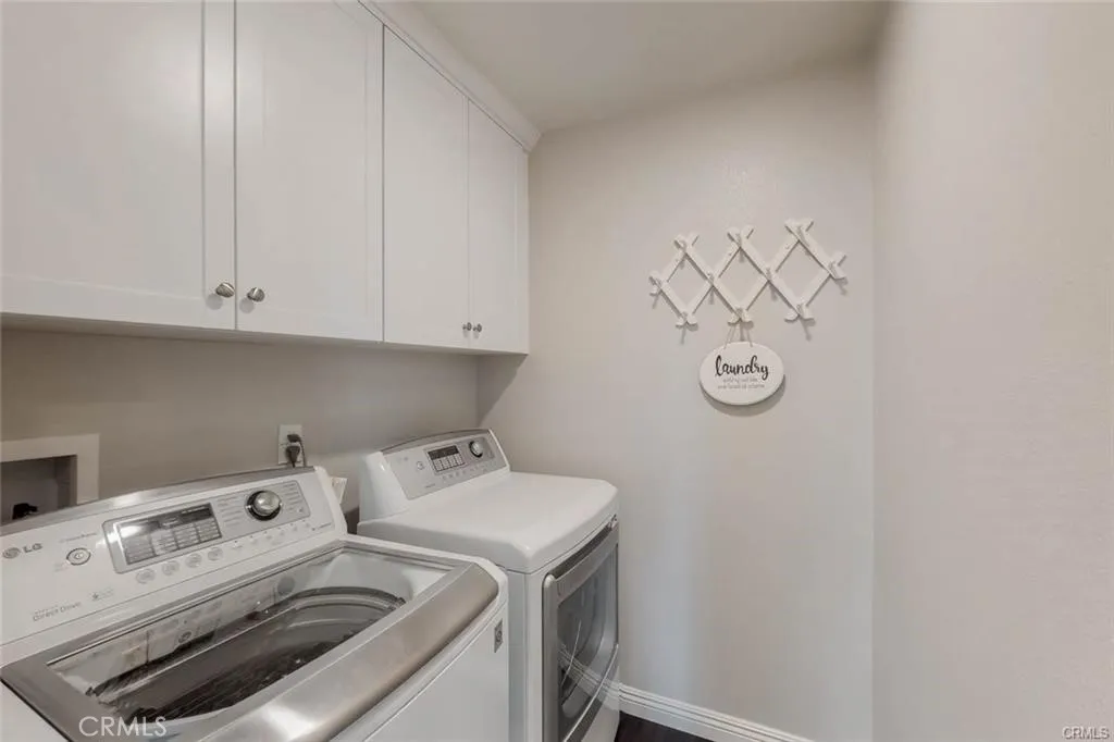 Laundry Room with newer washer and dryer are included in the sale and lots of Cabinetry