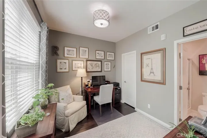 This was used as an office, but it is also used as bedroom with A Full walk in Closet and a Full Bathroom and a lovely picture window to enjoy the nice breeze and work at during the daytime hours.