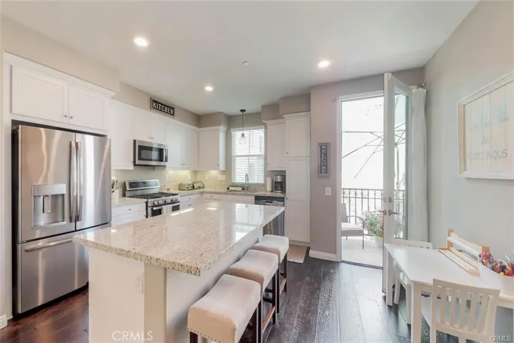 The Back of the home opens up to an enclosed patio area to step out and enjoy your first coffee and enjoy the Lovely Breeze of Anaheim, or the Sounds of Disneyland and the fireworks.