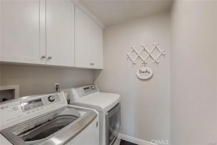 Laundry Room with newer washer and dryer are included in the sale and lots of Cabinetry