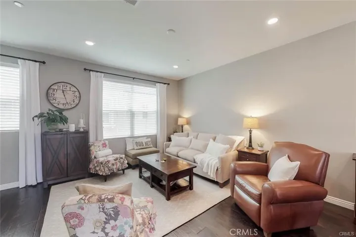 The Living room Staged from another angle. Beautiful wood flooring throughout this floor.