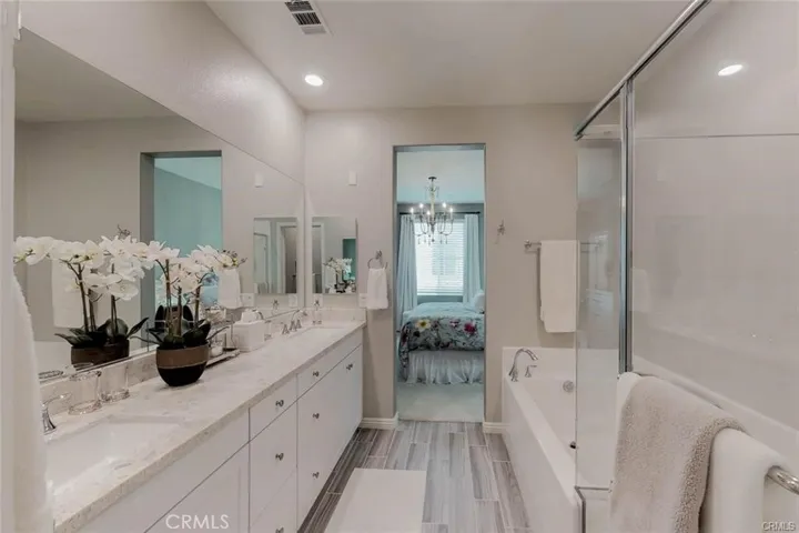 The Master Bedroom with A Separate Shower with A rain faucet to enjoy along with a relaxing soaking Tub and take the time to Unwind and enjoy your soaking tub, Separate Toilet Closet the Dual sinked and great storage for bathing needs chance to unwind.