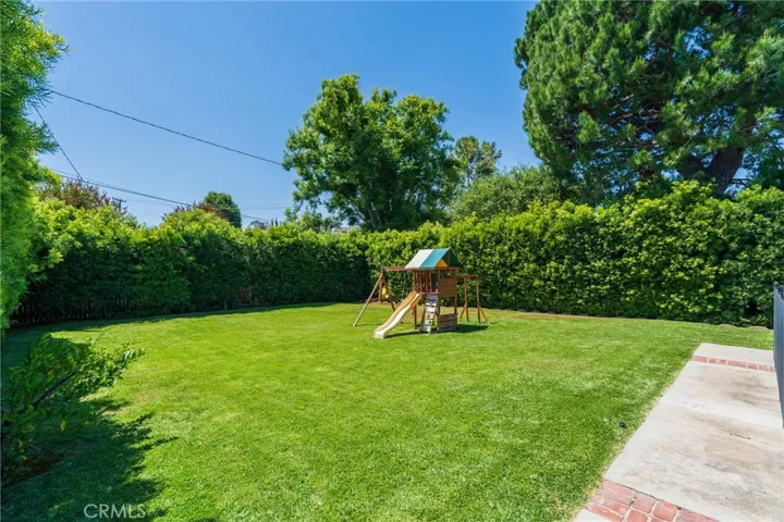 Large grassy yard with playground.