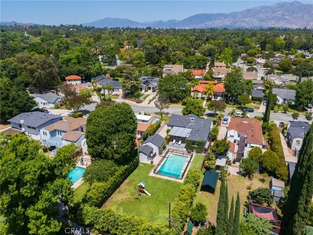 Aerial view facing north of the San Gabriel mountains. Home borders San Marino in close proximity to Coolidge Elementary, Valentine Elementary, Huntington Middle School, Lacy Park, Huntington Library, San Marino Community Church, and major thoroughfare on Huntington Drive to Pasadena, Arcadia, and Downtown Los Angeles.