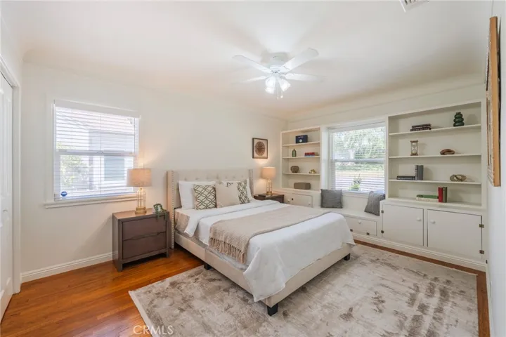Large bedroom with built-in shelving.