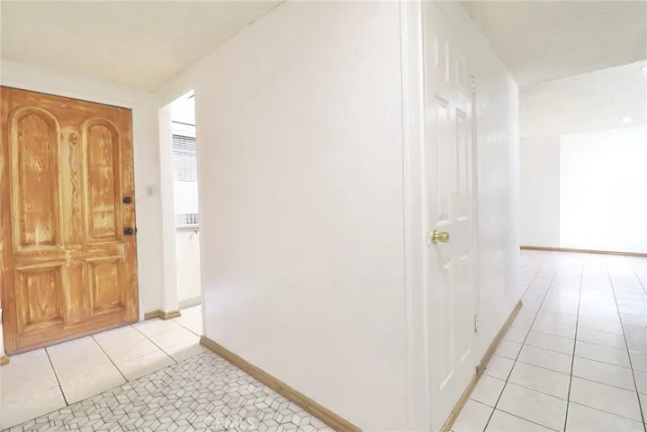 Hallway opens up to Kitchen and leads to Living Area