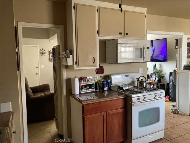 Kitchen closer view, looking through to living room